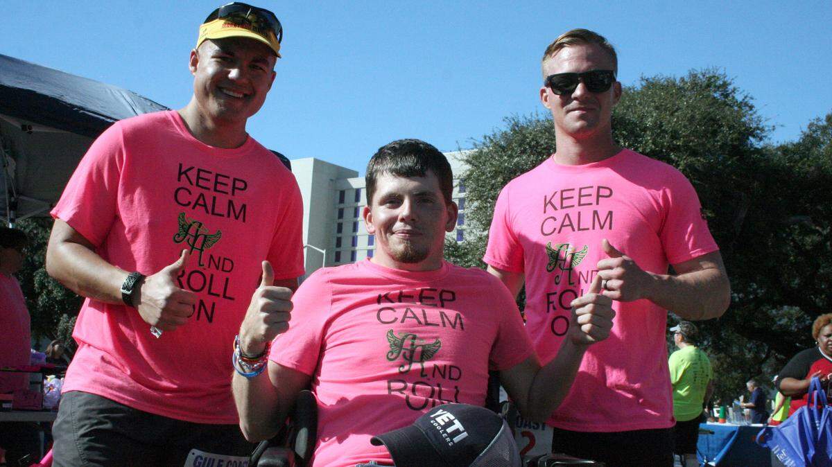 SHANNON DAVIDSON/SPECIAL TO THE SUN HERALDEric Brumbalow, left, Logan McDonald, and Cameron Gleason celebrate after completing the 28th annual Arbor Day 5K and Disability Awareness run Saturday in Biloxi.