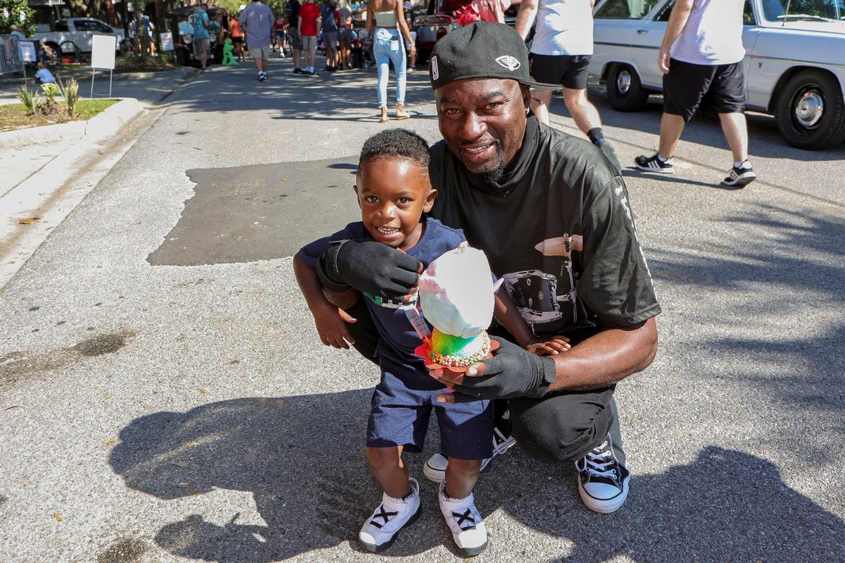 A young fan gets ready to cool down with a huge snow cone during the Ocean Springs Cruisin’ the Coast Block Party, October 8, 2021.