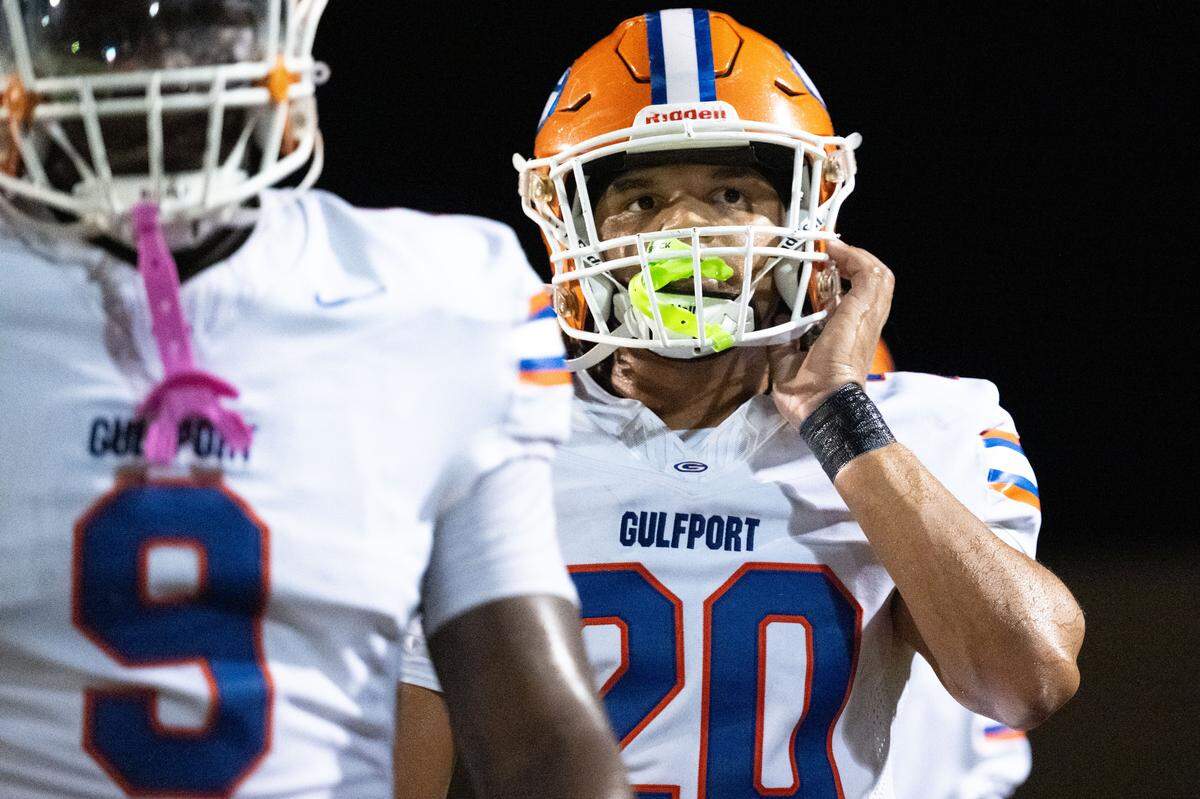 Gulfport outside linebacker Deandre Williams (20) takes off his helmet after a drive Friday. Gulfport defeated Pascagoula, 53-13.