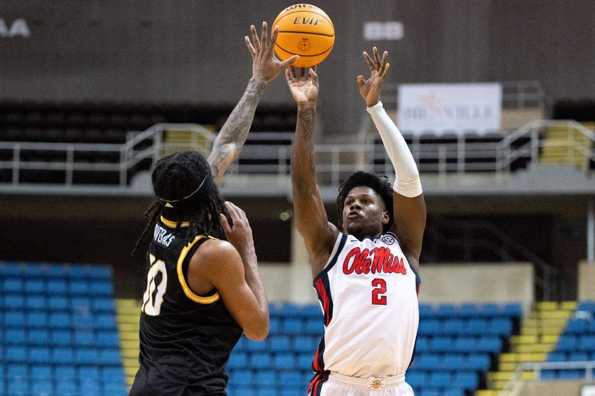 Mississippi guard AJ Storr (2) takes a shot at the basket.