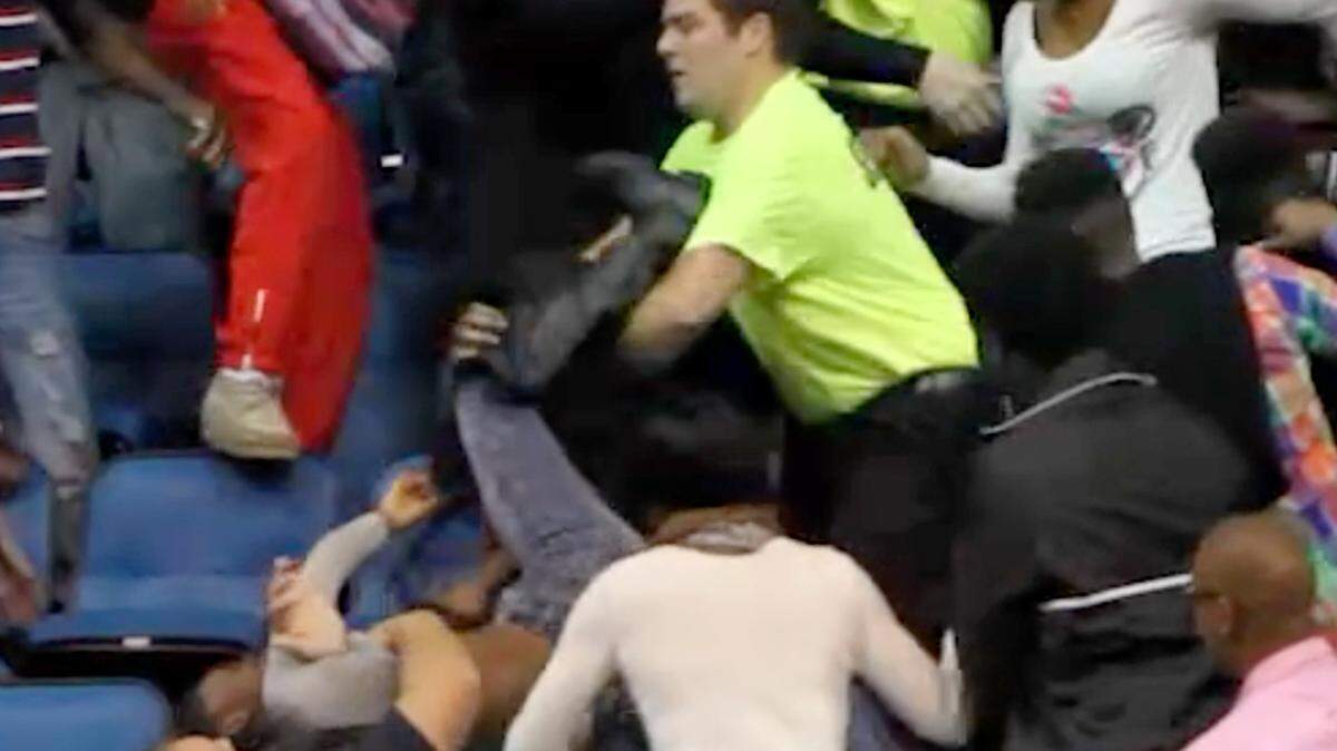 JOHN FITZHUGH/SUN HERALDPolice and Swetman Security workers try to break up a fight at the Mississippi Coast Coliseum in Biloxi during the Hoopsfest basketball event in January.