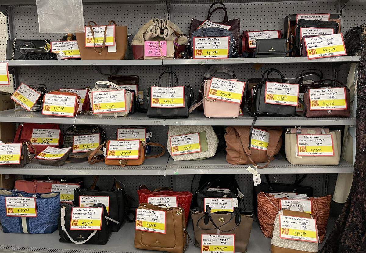 Name brand purses are among the upscale merchandise featured at Dirt Cheap in Gulfport, a new “super lux” store.