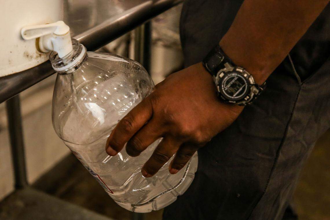 A large water bottle is filled with Lazy Magnolia’s own hand sanitizer the brewery made to sell to the community as mass-produced bottled became hard to find in stores amid the new coronavirus outbreak.