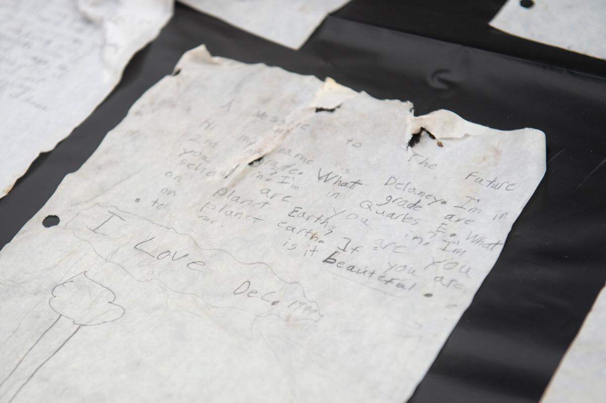 Letters written by to students were among the items from a time capsule that was buried at W. J. Quarles Elementary in Long Beach in 1999 and opened on Friday, Dec. 13, 2024.