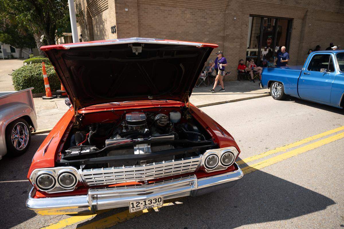Event attendees check out cars Wednesday at the Biloxi Block Party.