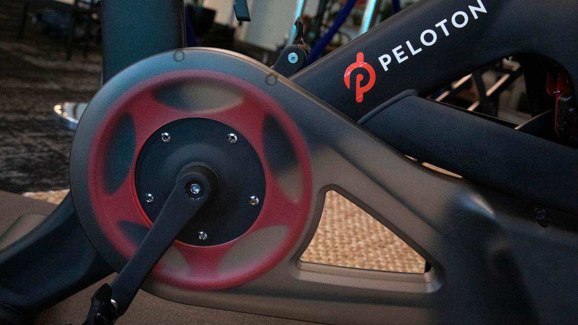 FILE - In this Sept. 26, 2019 file photo, the Peloton logo is displayed on the company’s stationary bicycle in New York. Cybersecurity company McAfee said it recently found a security threat in the Peloton Bike+ that could allow hackers to spy on riders and steal sensitive information. (AP Photo/Mark Lennihan, File)