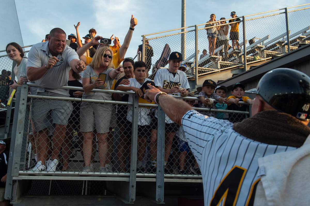 Coach Berry points to cheering fans as he walks into the locker room after defeating LSU 8-7 in the NCAA Regionals at Pete Taylor Park in Hattiesburg on Monday, June 6, 2022.
