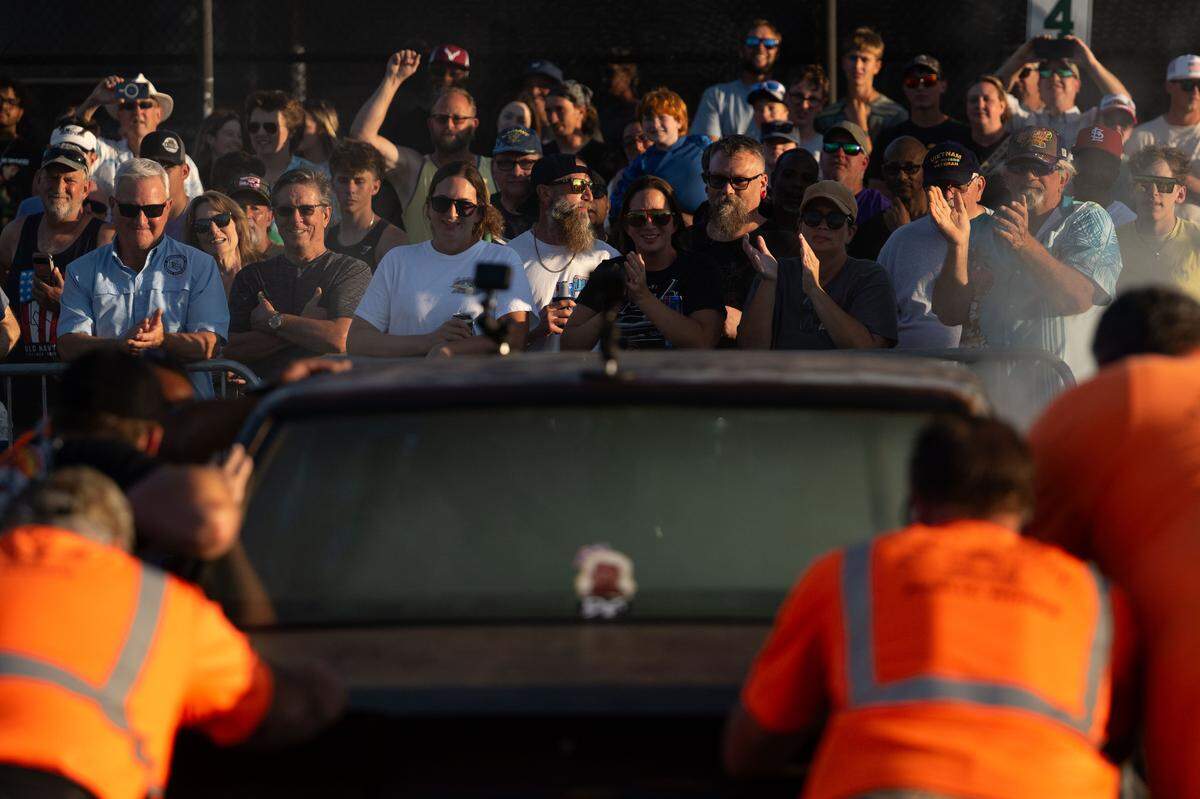 Crowd members cheer on a car it burned out during Burn ‘Em Up In The Pass on Thursday, Oct. 9, 2025.