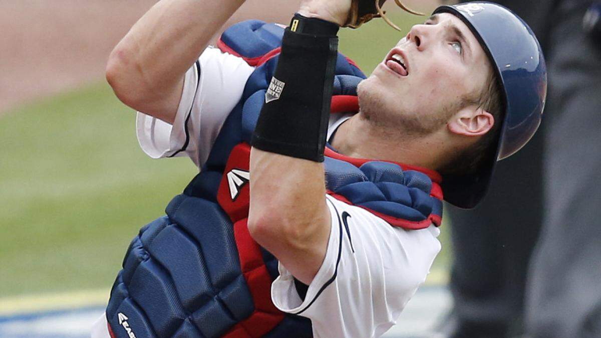 Mississippi catcher Henri Lartigue catches a foul ball against Texas A&M during the seventh inning of a Southeastern Conference NCAA college baseball tournament game at the Hoover Met, Saturday, May 28, 2016, in Hoover, Ala. (AP Photo/Brynn Anderson)
