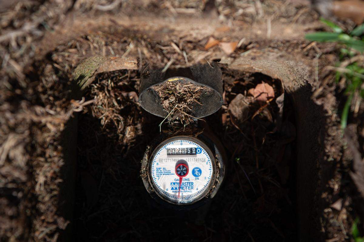 A new water meter remains active in McComb on Dec. 13, 2023.