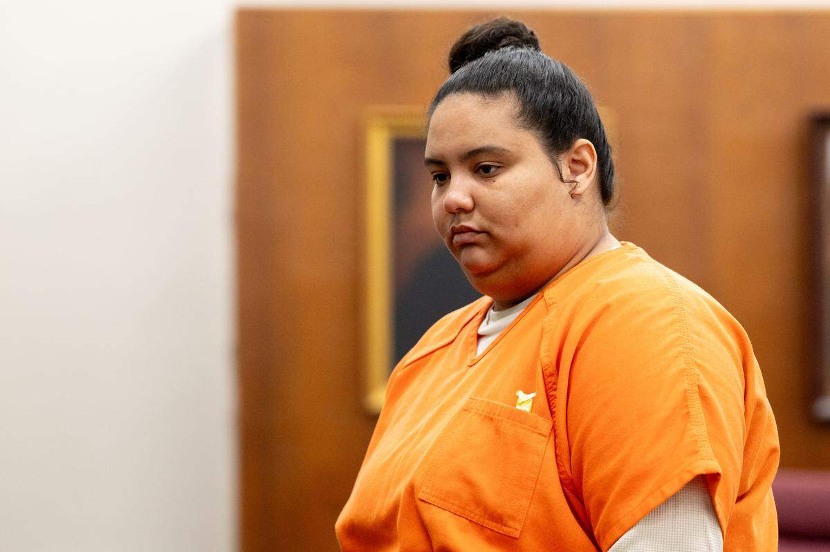 Jasmine Drake walks away from the podium Tuesday after pleading guilty to human trafficking before Judge Christopher Schmidt at the Harrison County 2nd Judicial District Courthouse.