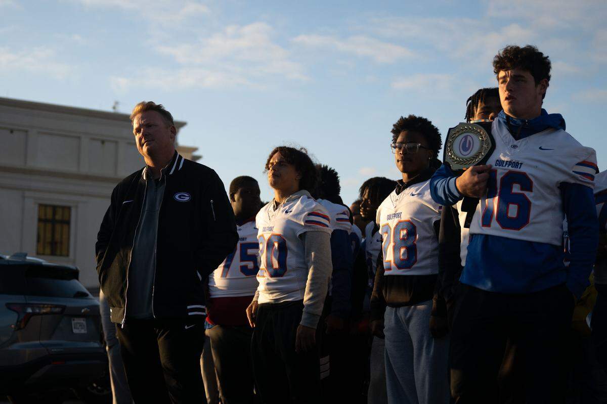 The Gulfport football team lines up as they prepare to walk during the Champions Christmas Parade in Gulfport on Monday, Dec. 8, 2025.