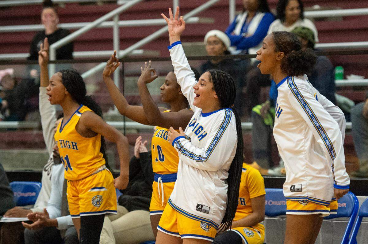 Bay High’s bench players cheer as a player scores a three pointer during a game against Pass Christian in Pass Christian on Tuesday, Jan. 23, 2024.