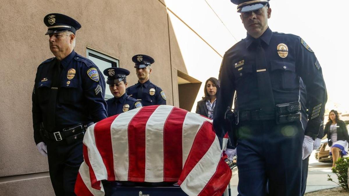 Palm Springs police officers carry the casket of officer Jose 'Gil' Vegaat Palm Springs Convention Center on Tuesday, Oct. 18, 2016, in Palm Springs, Calif., amid services for fallen officers Lesley Zerebny and Vega, who were gunned down Oct. 8 after responding to a family disturbance call at a Palm Springs residence.