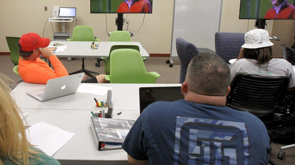 TIM ISBELL/SUN HERALDStudents watch Billy Collins reading some of his poetry in class at USM Gulf Park this month.