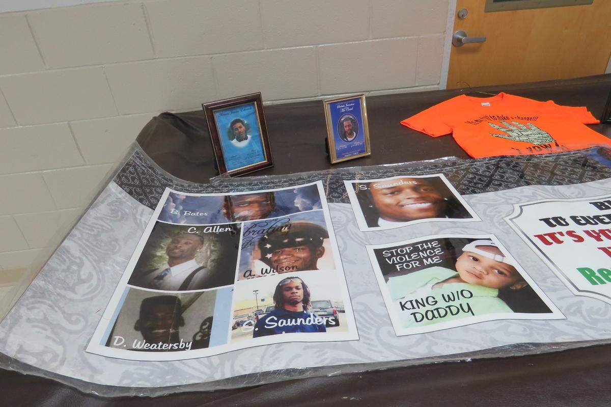 At the Gaston Point community meeting on Jan. 11, 2022, Christene Bryce set up a memorial to Gulfport’s victims of gun violence,