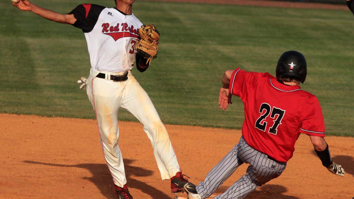 JOHN FITZHUGH/SUN HERALD 
 Harrison Central shortstop Ian Colon had three RBI in the Red Rebels' 12-0 win over Picayune.