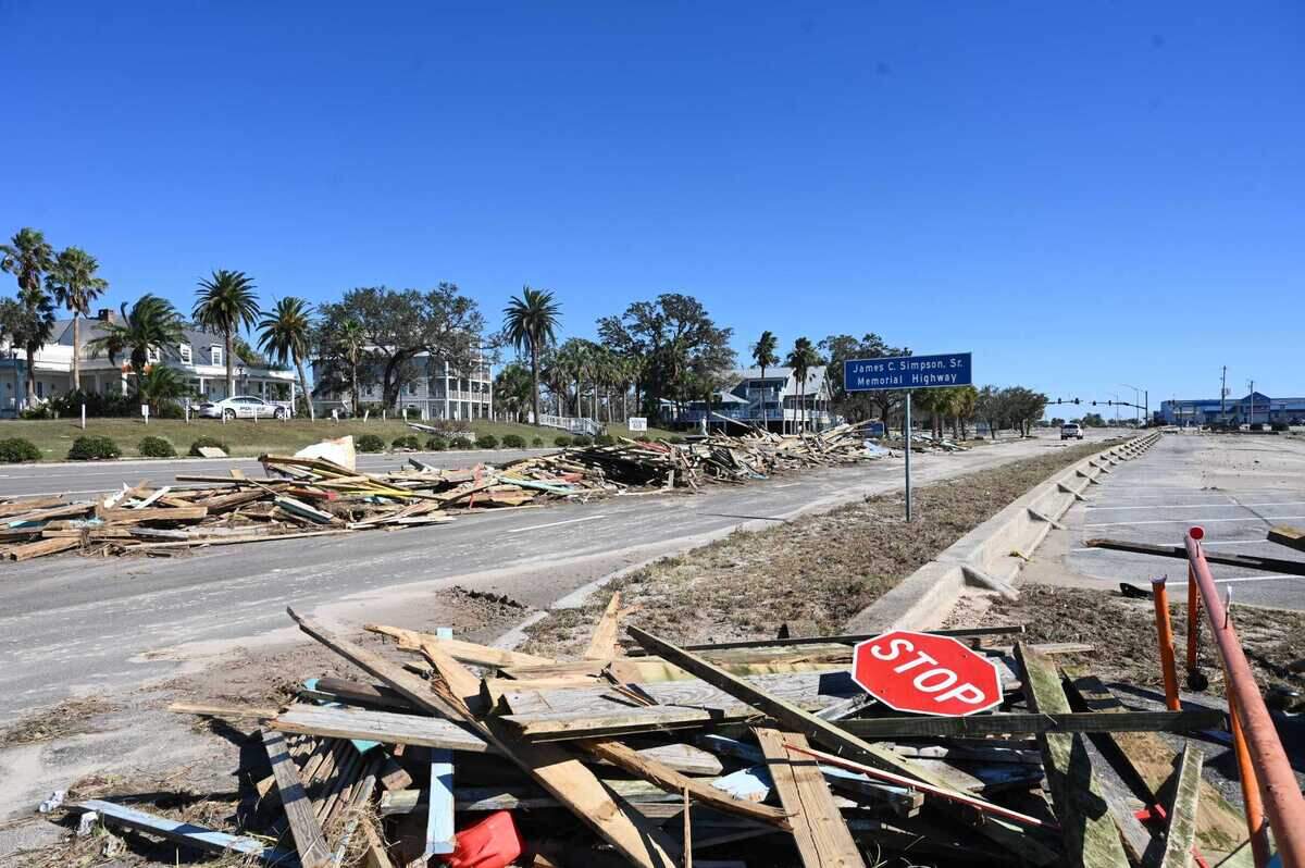 Piles of debris were strewn along Highway 90 in Pass Christian, Mississippi, after Hurricane Zeta tore through the Gulf Coast overnight.
