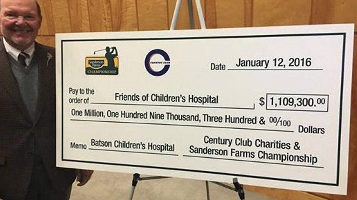 RICK CLEVELANDJoe Sanderson presents the University of Mississippi Medical Center with a $1.1 million-plus gift from the Sanderson Farms Championship, a PGA Tour event in Jackson.