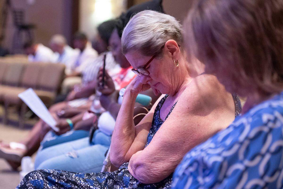 Judy Cazeaux prays during a coast-wide candlelight ceremony as a part of National Crime Victims’ Rights Week at First Baptist Church of Gulfport on Tuesday, April 29, 2025. Cazueax’s daughter Cynthia Michelle Cazeaux was killed in a robbery in 2002.