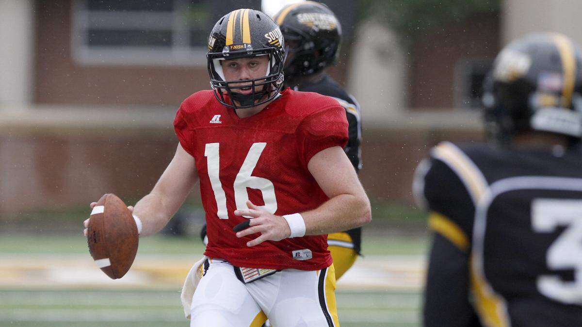 TIM ISBELL/SUN HERALD 
 Quarterback Tyler Matthews scrambles for yards during Southern Miss Spring game, Saturday, April 18, 2015.