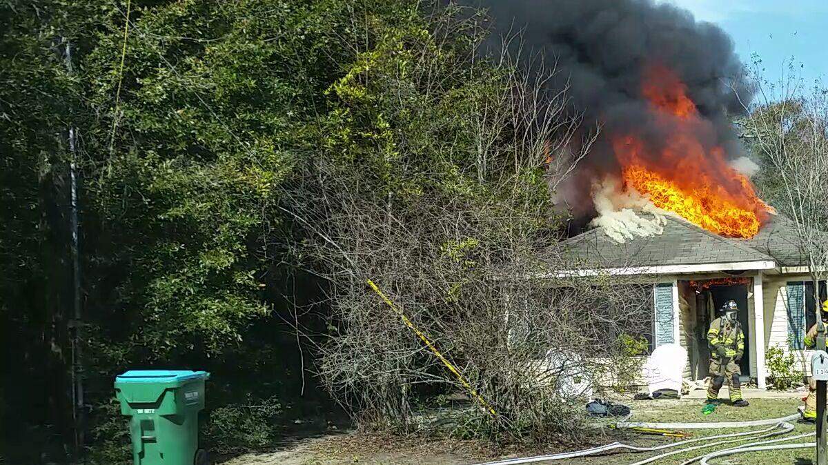 Gulfport firefighters battle a fire at 25 Street and Oak Avenue on Sunday morning. No one was home and no injuries were reported.