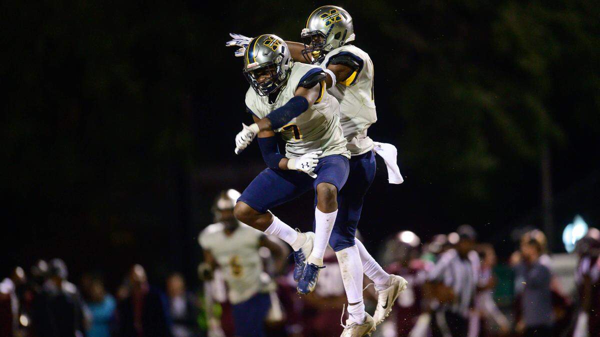 Mississippi Gulf Coast Community College defensive backs Jackie Matthews (7), left, and Malik Jones celebrate during the Bulldogs’ win at Hinds in Ryamond on Thursday, Oct. 25, 2019.