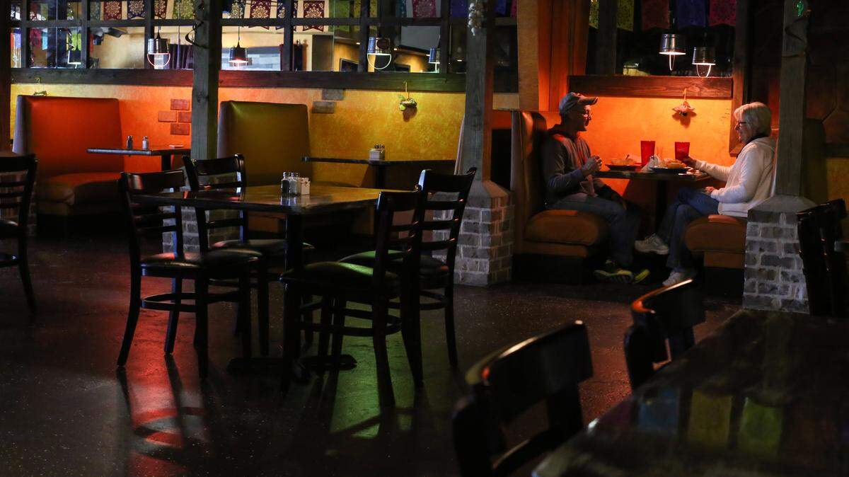 JUSTIN MITCHELL/SUN HERALDA couple eats a late lunch at El Mariachi and Juan Tequila's just off the Canal Road exit in Gulfport.