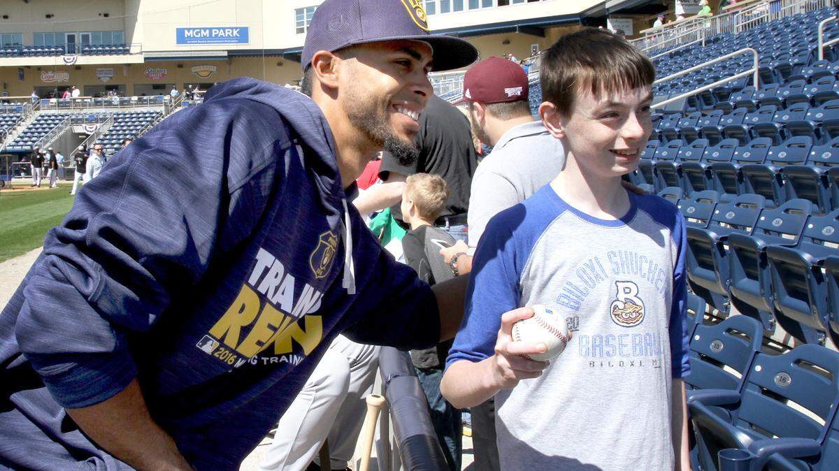 TIM ISBELL/SUN HERALD 
 David Seibold has his picture taken with Yadiel Rivera prior to exhibition game between Shuckers and Brewers at MGM Park, Saturday, Apr. 2, 2016.