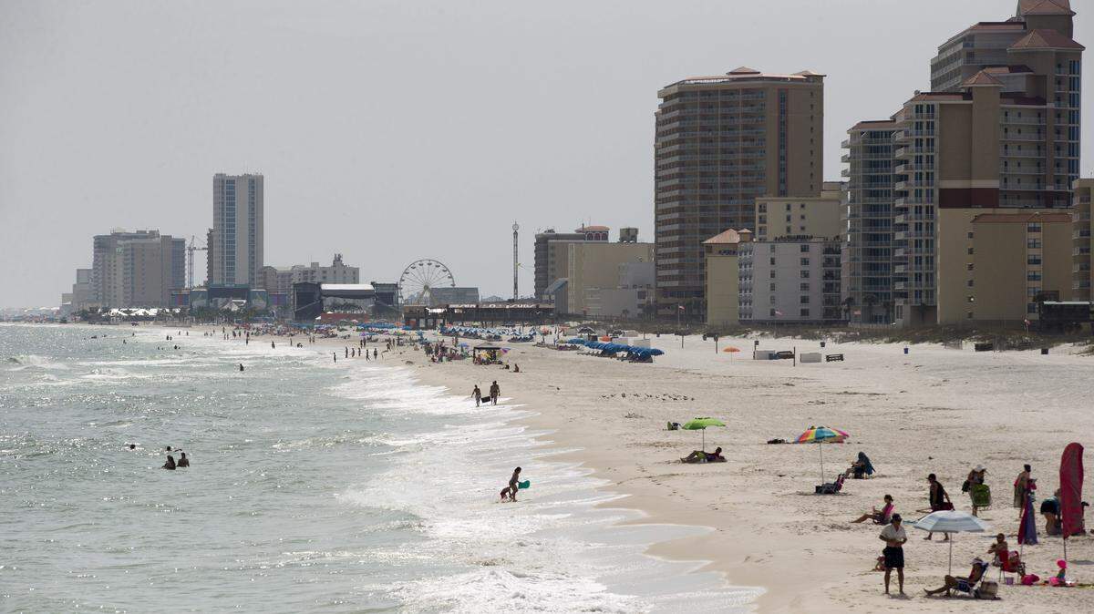 In this Wednesday, May 13, 2015 photo, tourists line the beaches in Gulf Shores, Ala. (AP Photo/Brynn Anderson)
