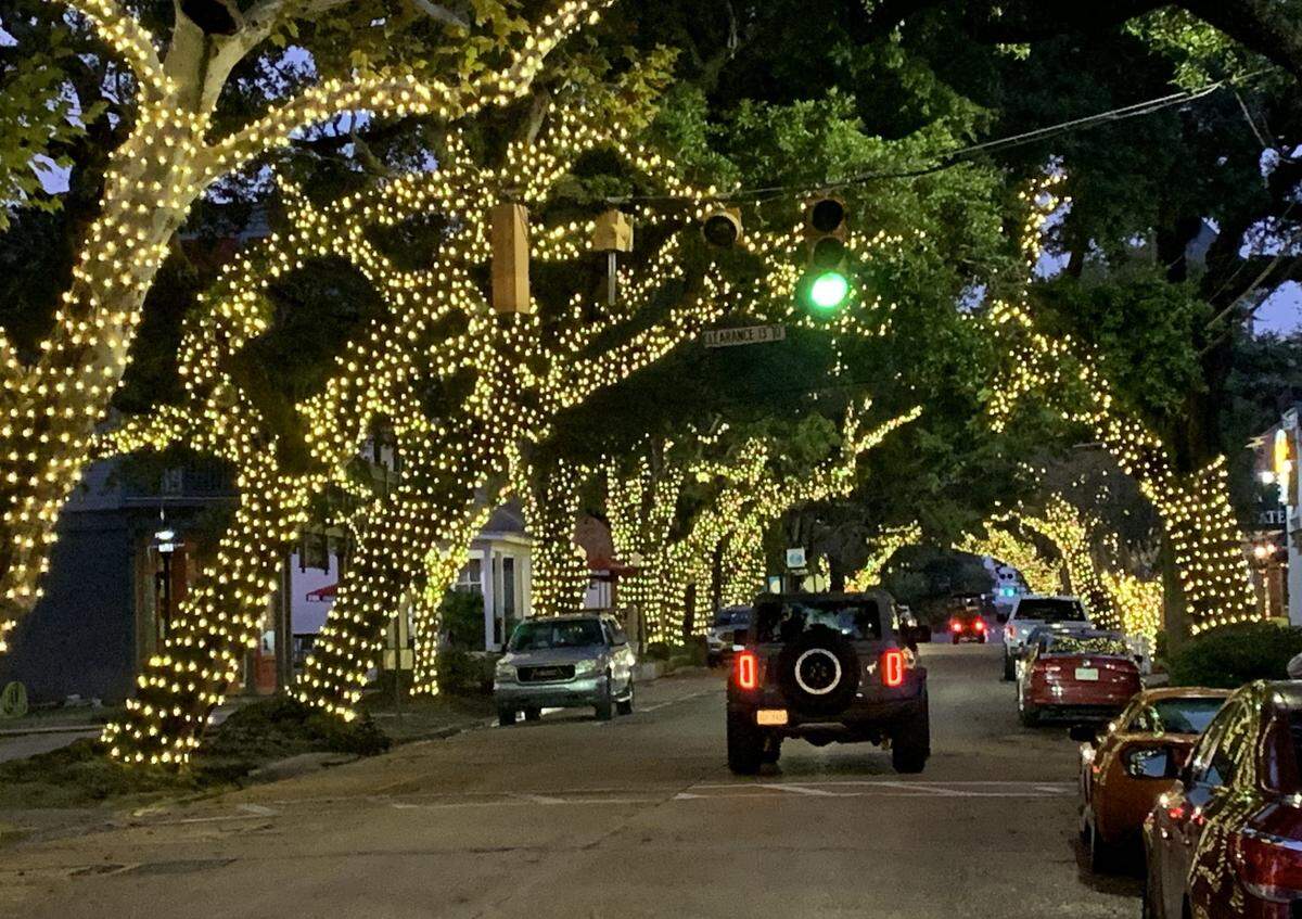 A tunnel of lights in the oak trees along Washington Avenue brightens downtown Ocean Springs for the holidays.