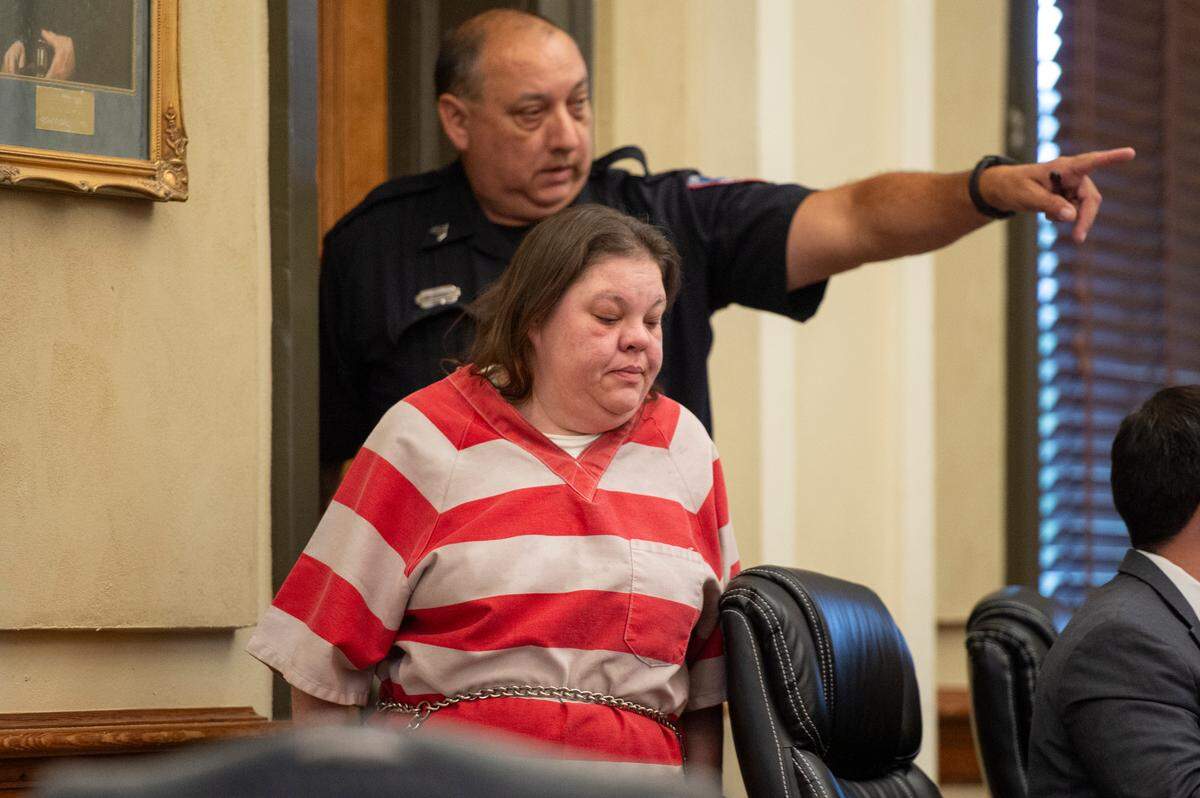 A police officer escorts Angela James as she appears in Hancock County Circuit Court to plead guilty on Monday, June 17, 2024. James pled guilty to manslaughter in the death of Katie Cash after a fatal 2021 crash.