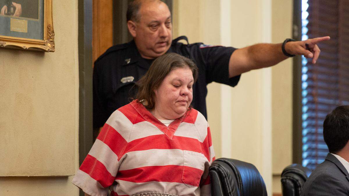 A police officer escorts Angela James as she appears in Hancock County Circuit Court to plead guilty on Monday, June 17, 2024. James pled guilty to manslaughter in the death of Katie Cash after a fatal 2021 crash.