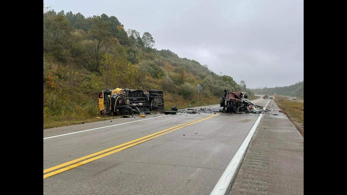 A driver died when his truck crashed with a school bus and burst into flames on a highway in Mingo County, West Virginia, on Oct. 18, police said.