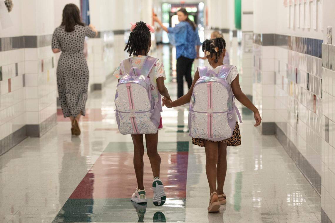 Students walk to their classrooms on the first day of school at North Bay Elementary School in Biloxi on Thursday, July 27, 2023.