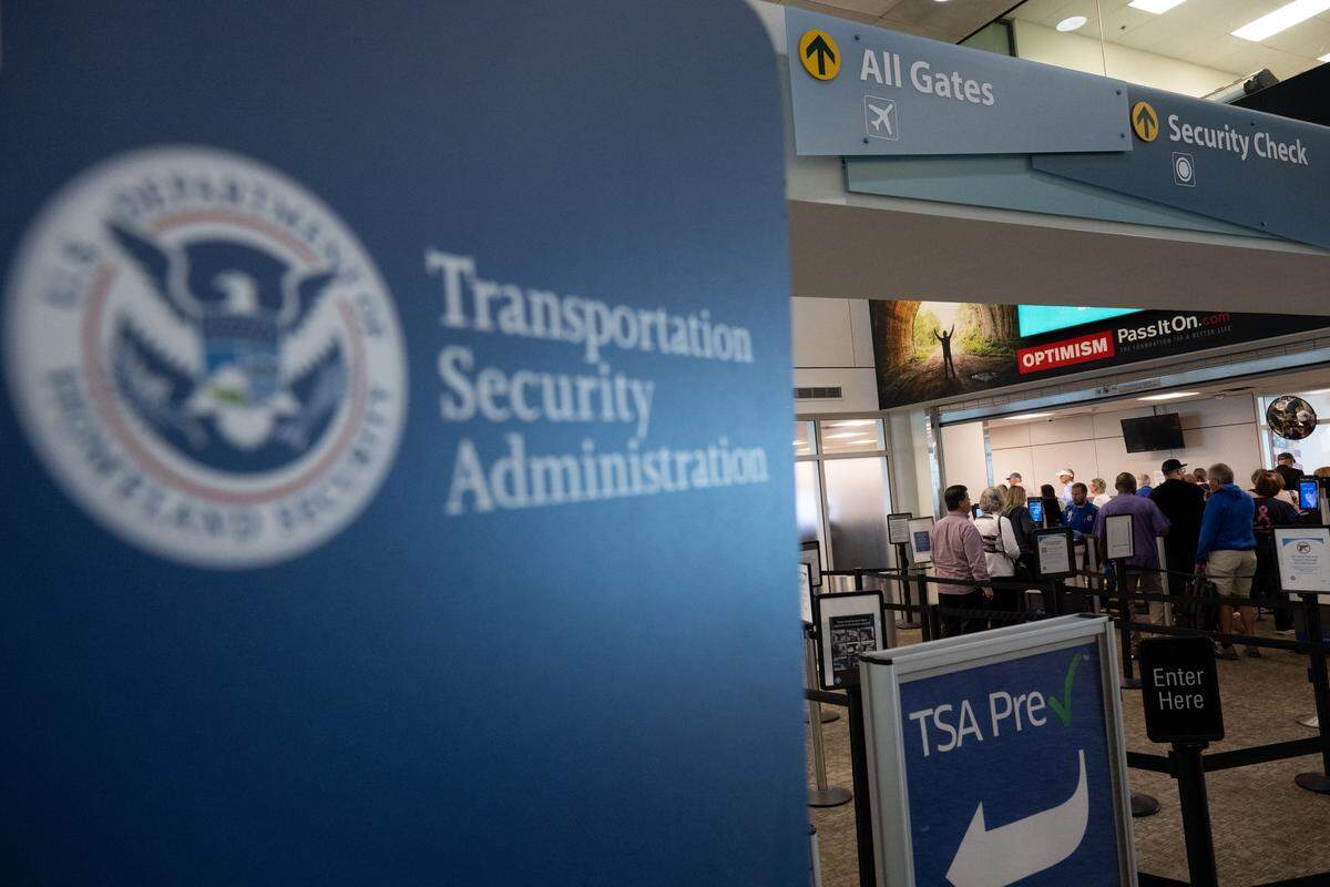 Passengers line up at a TSA security checkpoint at Gulfport-Biloxi International Airport on Wednesday.