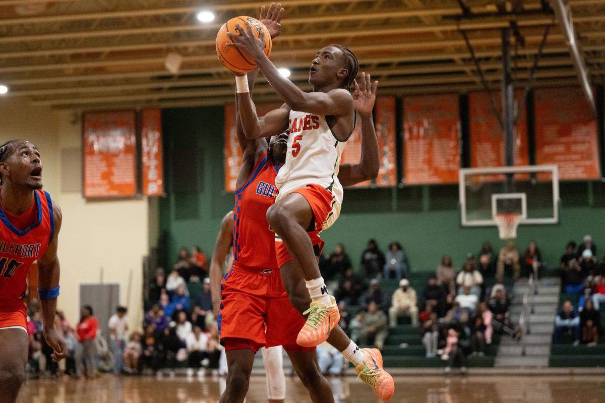 West Harrison's Kameron Bolden (5) lays up the ball during a basketball game at West Harrison High School on Tuesday, Jan. 13, 2026.