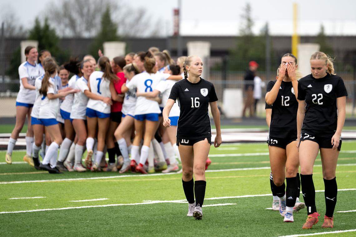 Long Beach players walk off the field as Saltillo players celebrate after a 6A girls soccer state championship game at Germantown High School in Jackson on Saturday, Feb. 21, 2026.