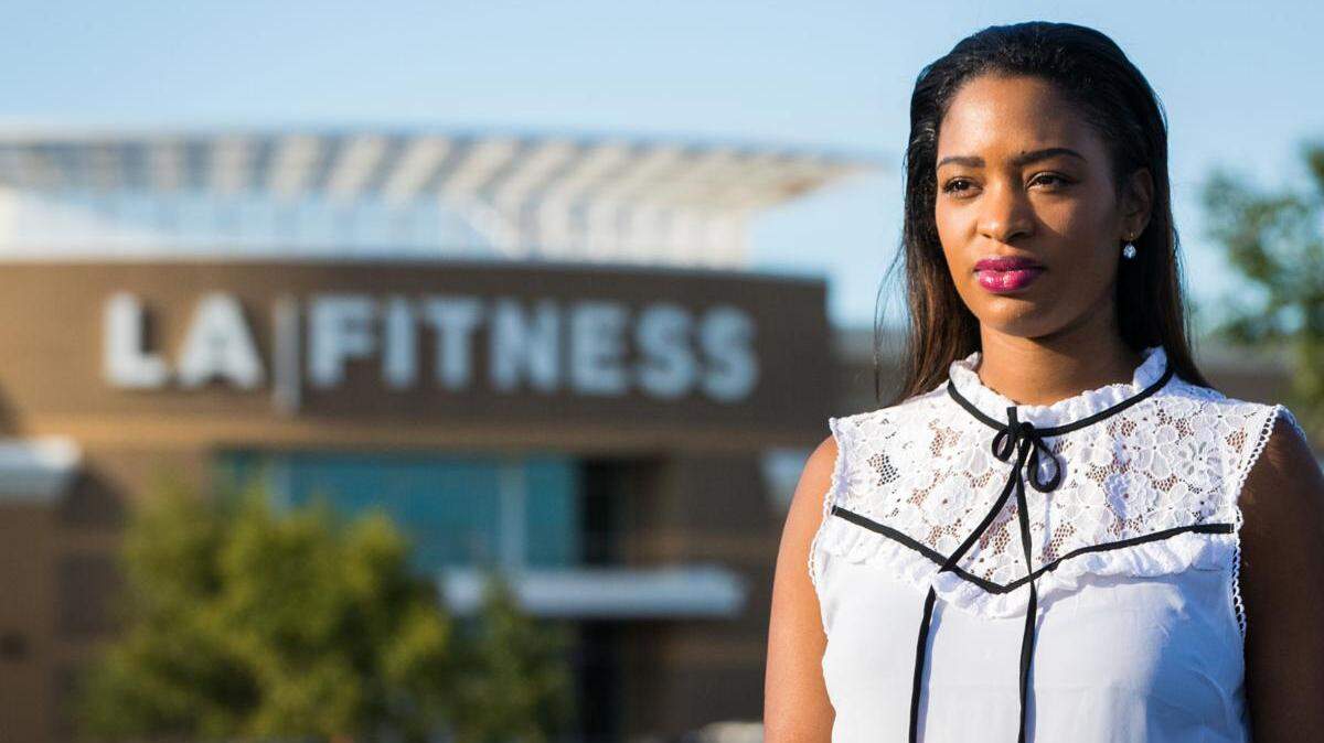 Aireial Mack poses in front of LA Fitness in Slidell on Tuesday, Sept. 25, 2018. She is a former employee who says she experienced racial discrimination while she worked at the gym.