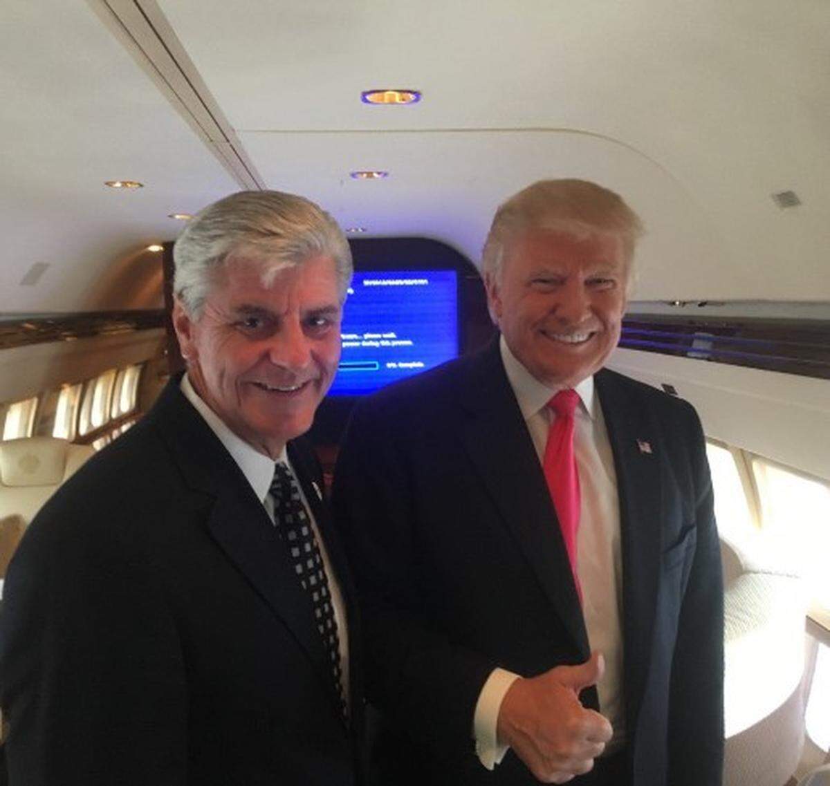 Former Mississippi Gov. Phil Bryant poses with Donald Trump.