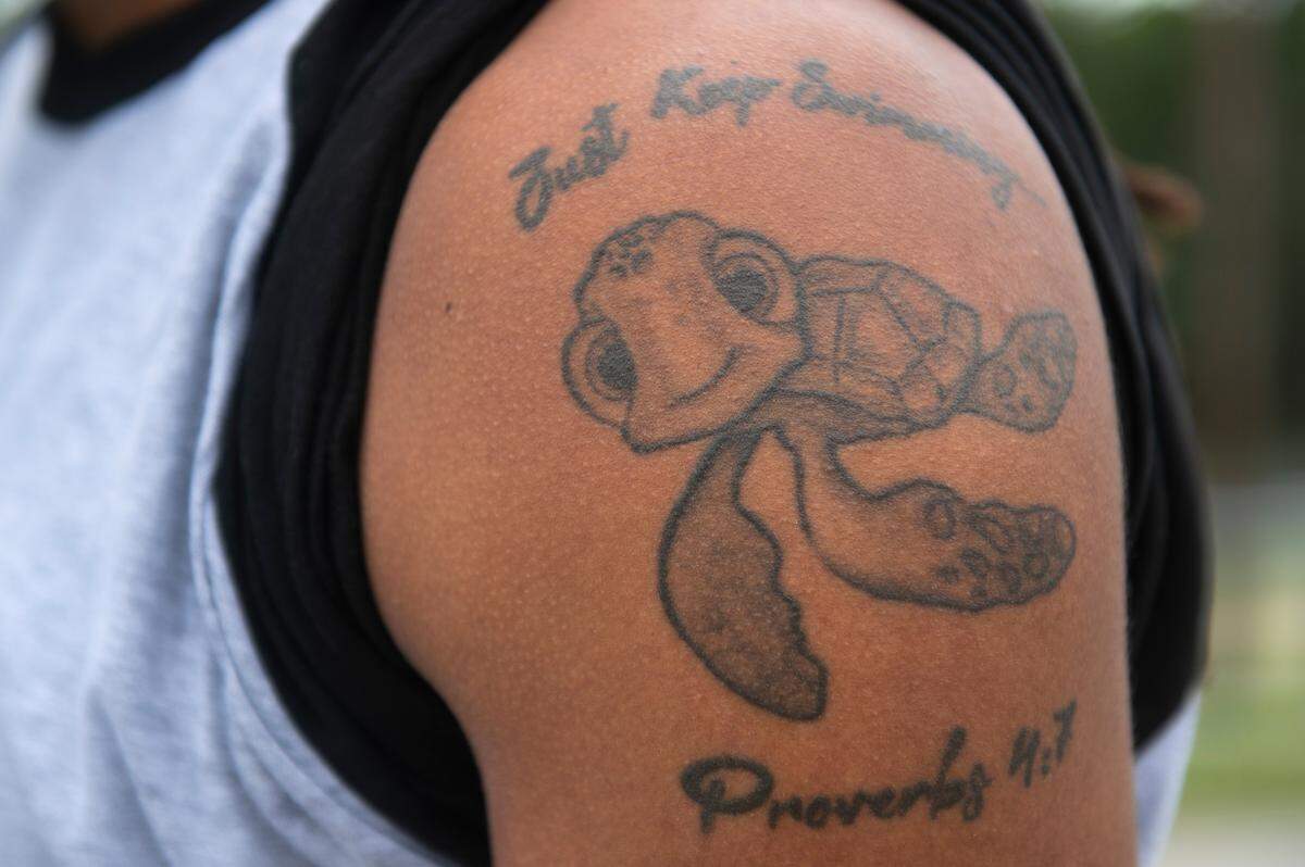 Jerry Asiel Thompson, owner of the Mississippi Coast’s new ABA basketball team the Sea Turtles, shows off his tattoo of turtle character Squirt at Hiller Park in Biloxi Tuesday, July 23, 2024. Thompson relocated the Sea Turtles to his hometown of Moss Point from California.