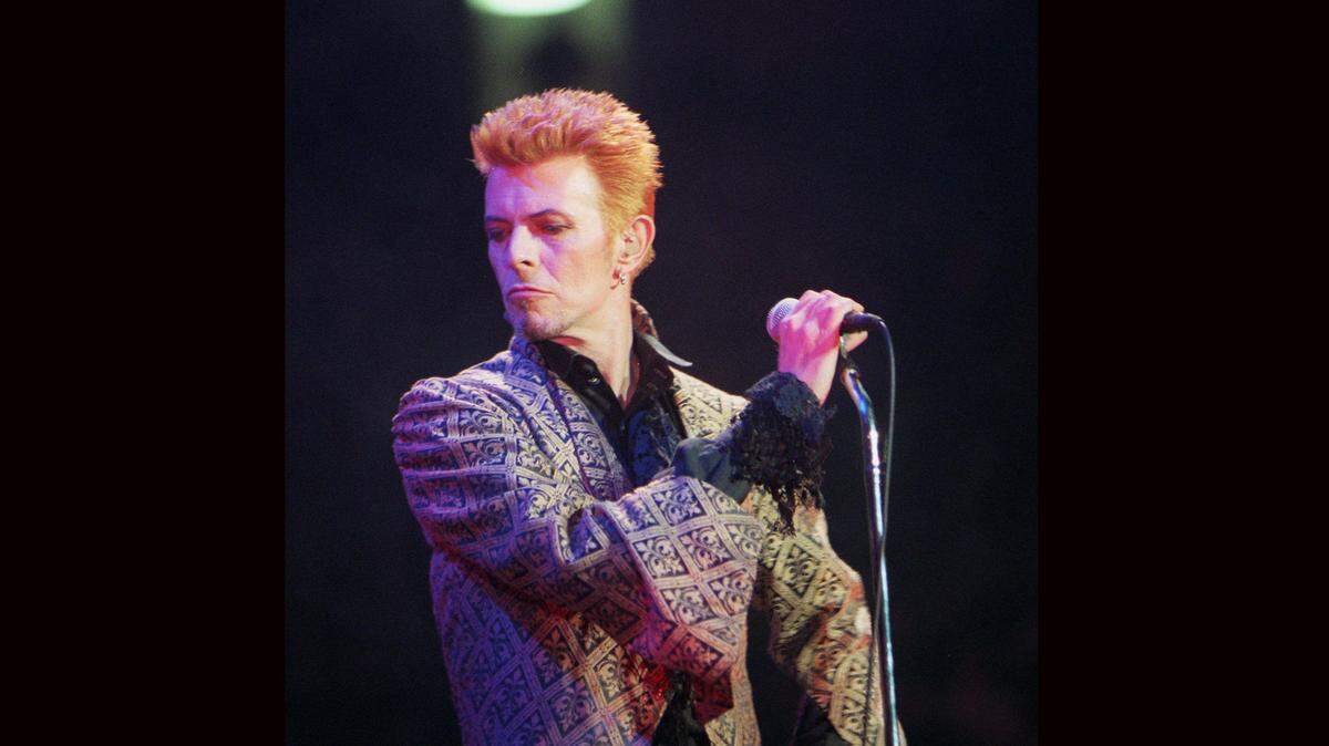 In this Jan. 9, 1997, file photo, David Bowie performs during a concert celebrating his 50th birthday, at Madison Square Garden in New York. Bowie, the innovative and iconic singer whose illustrious career lasted five decades, died Monday, Jan. 11, 2016, after battling cancer for 18 months. He was 69. (AP Photo/Ron Frehm, File)