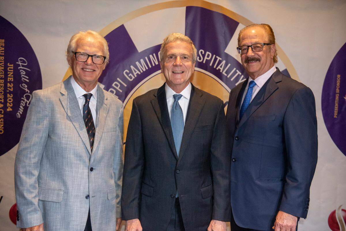 Mississippi Gaming and Hospitality Association Hall of Fame inductees Tim Hinkley, left, Tom Gresham, and Jon Lucas, right, pose for a portrait at the Mississippi Gaming and Hospitality Association Hall of Fame Gala at the Beau Rivage in Biloxi on Thursday, June 27, 2024.