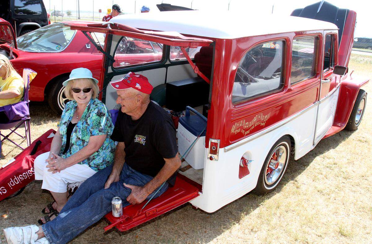 Richard and Sylvia Davis of Biloxi watch the action from the back of their 1953 Willys station wagon during the last day of Cruisin’ The Coast at Cruise Central at Centennial Plaza in Gulfport in 2010.