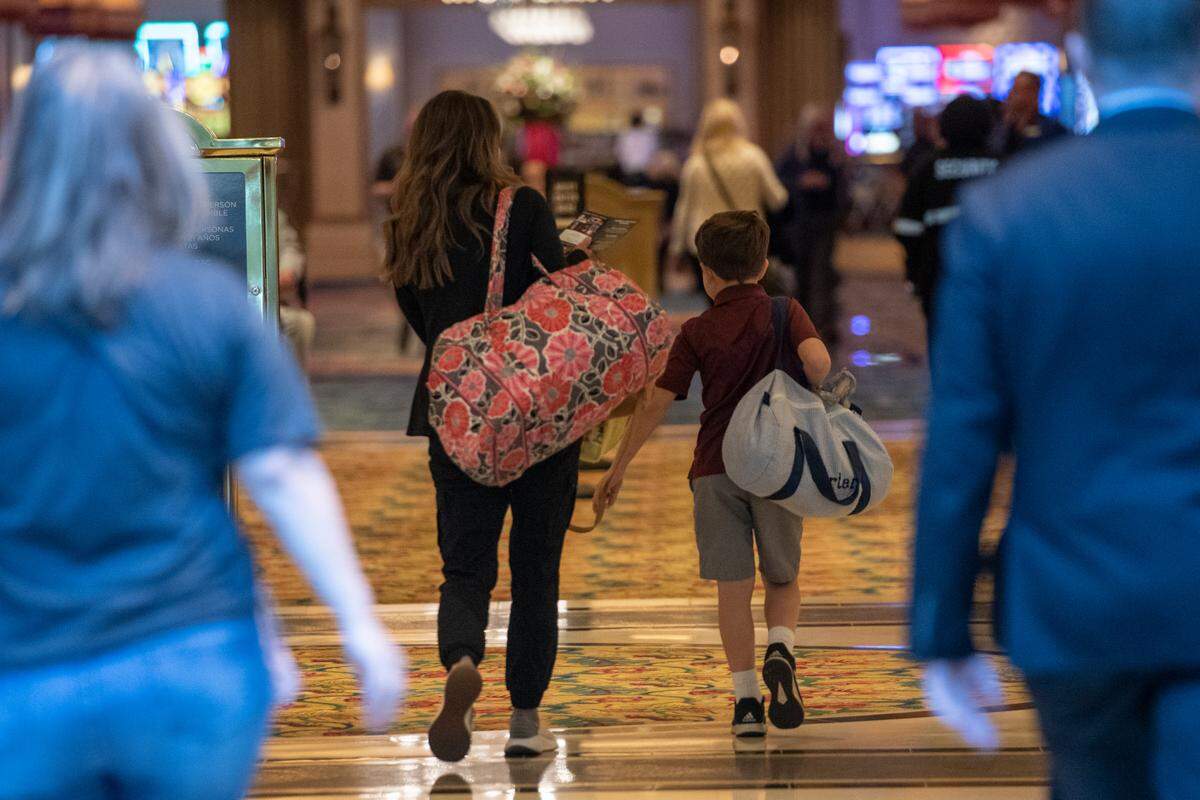 A family walks through the Beau Rivage Casino in Biloxi on Thursday, Dec. 1, 2022 after checking in. The Beau Rivage is one of the few casinos on the Coast to allow children.