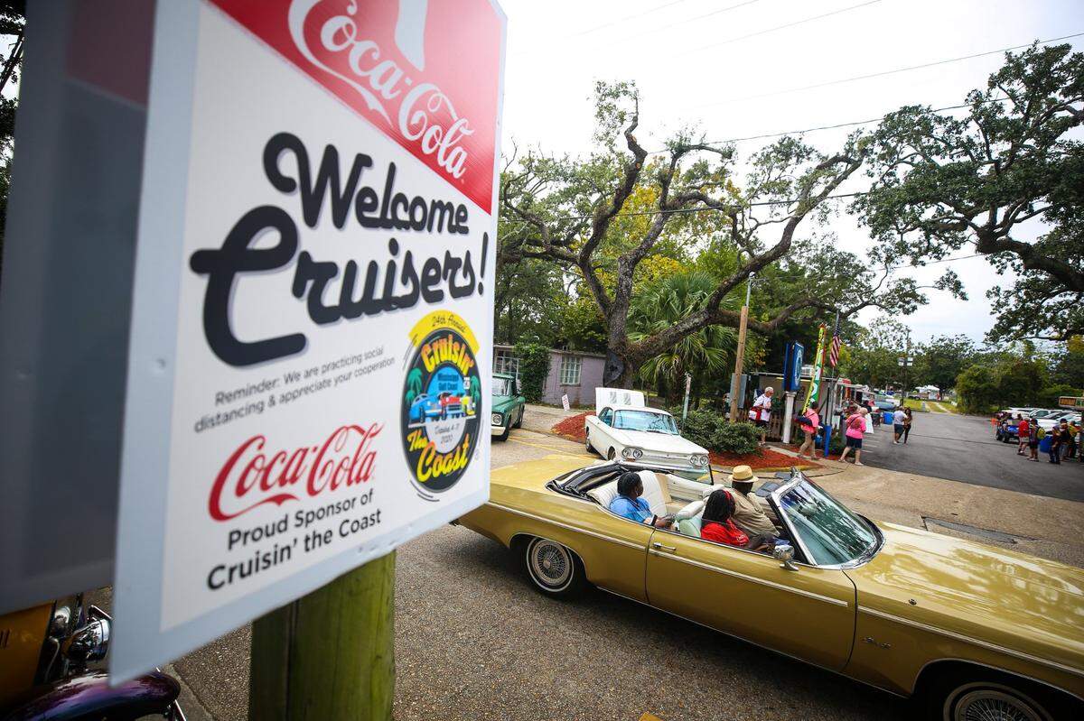 Classic cars roll down Washington Avenue in Ocean Springs during the 2020 Cruisin’ the Coast festivities.