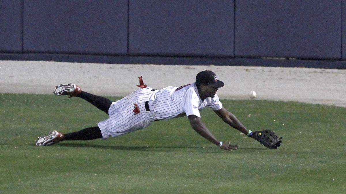 TIM ISBELL/SUN HERALD 
 The ball bounces away from William Carey centerfielder Adrian Brown after he made a diving attempt to catch a fly ball to deep center during game against Delta State at MGM Park, Wednesday, March 9, 2016.