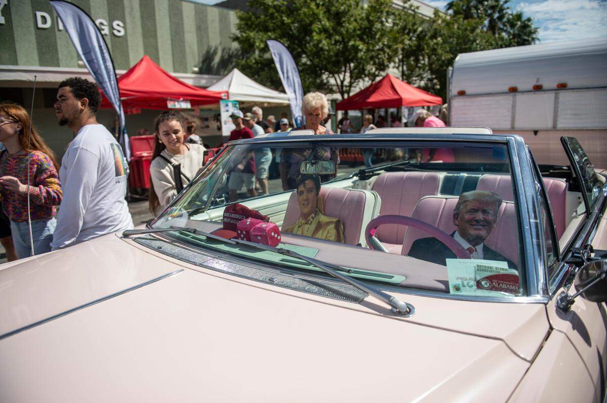 A pink car with cardboard cutouts of Elvis and Donald Trump during View the Cruise in downtown Gulfport on Sunday, Oct. 3, 2021.