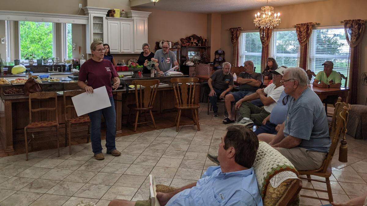 County constable Angel Kibler-Middleton shows plans for the subidvision to a gathering of two dozen neighbors who oppose the project at a meeting at her mother’s home near the proposed development site.