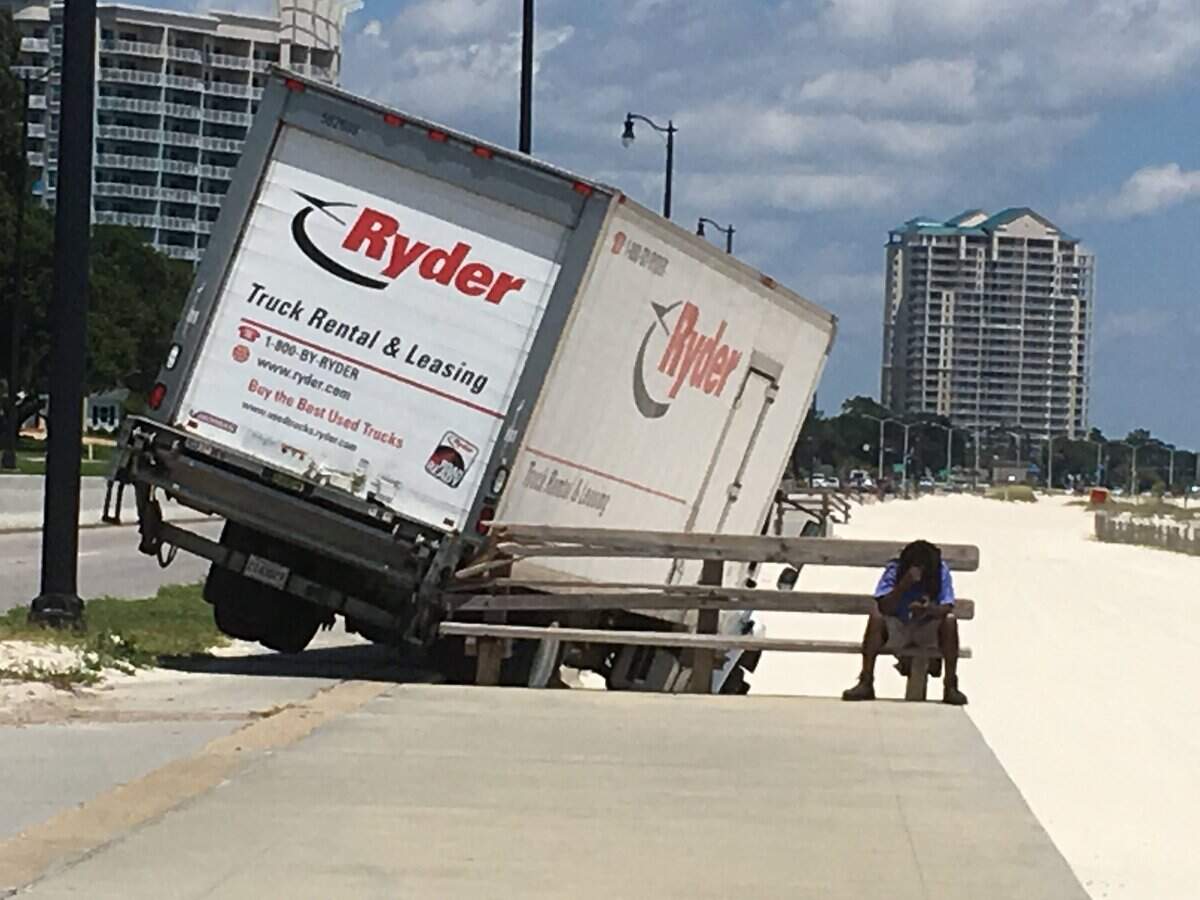 Jaron Moore sits on a damaged park bench across from the Great Southern Golf Club on U.S. 90 in July 2017 in Gulfport. He said he left the highway after the driver of a car in front of him suddenly slammed on the brakes.
